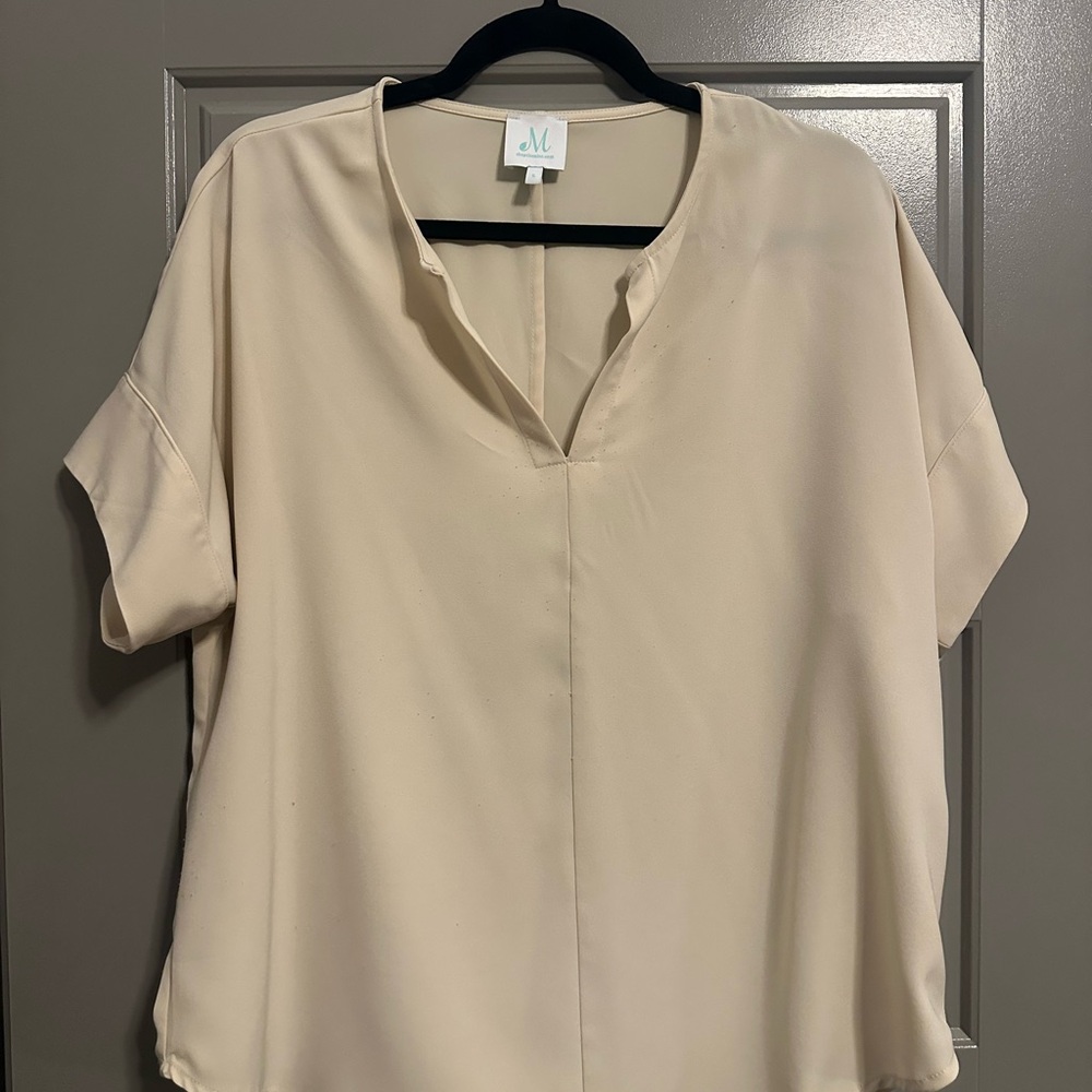 Women’s oversized cream blouse